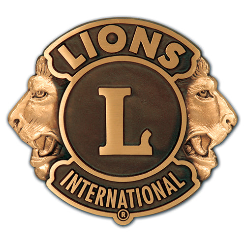 The Lions Club logo on a sign